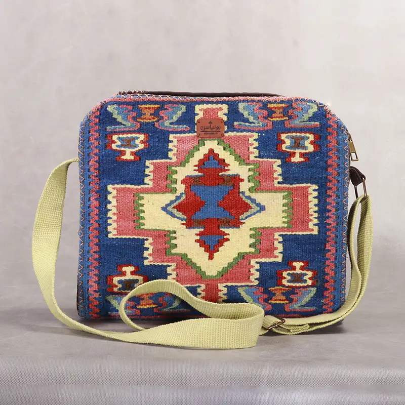 کیف دوشی گلیمی دستبافت با ترکیب رنگ آبی، نارنجی و زرد